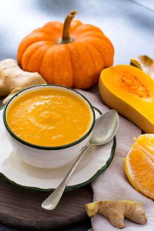 Homemade pumpkin cream soup made from fresh ripe bottle gourd pumpkinの写真素材