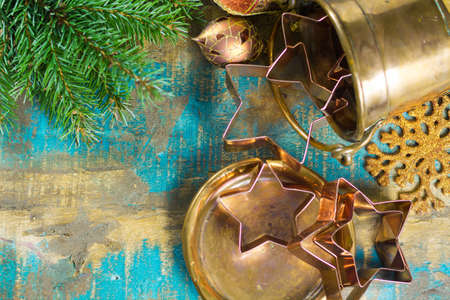 Golden metal cutting forms for christmas star cookies, biscuits, brass or copper with christmas decorationsの写真素材