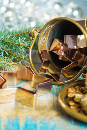 Golden metal cutting forms for christmas star cookies, biscuits, brass or copper with christmas decorationsの写真素材