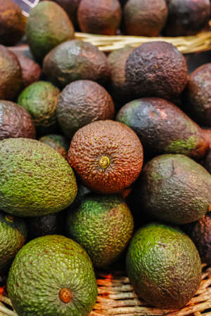 Many green and brown ripe organic adocados close upの写真素材