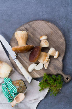 Boletus edulis, cepe, porcini mushrooms washed on gray concrete background, tasty food from forest, autumn menu, ready to cookの写真素材