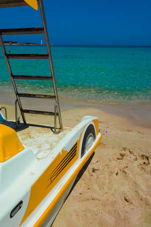 Colorful pedal-boats with water slides on the beach.の写真素材