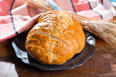 Sliced fresh baked white wheat bread and whole wheat earsの写真素材
