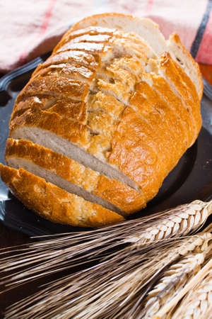 Sliced fresh baked white wheat bread and whole wheat earsの写真素材