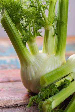 Fresh raw organic Florence fennel bulbs, close up on wooden tableの写真素材