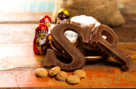 Traditional Dutch Saint Nicolas celebration with presents for children in December, Saint Nicolas  gift bag and chocolate letters close upの写真素材