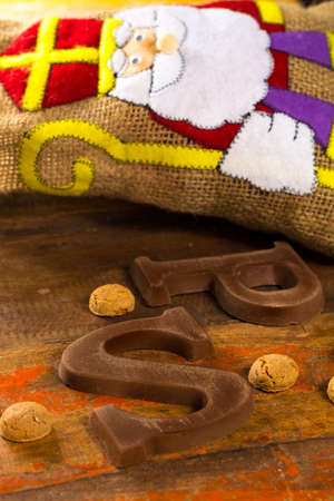 Traditional Dutch Saint Nicolas celebration with presents for children in December, Saint Nicolas  gift bag and chocolate letters close upの写真素材