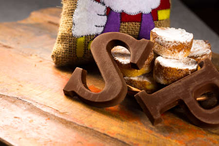Traditional Dutch Saint Nicolas celebration with presents for children in December, Saint Nicolas  gift bag and chocolate letters close upの写真素材