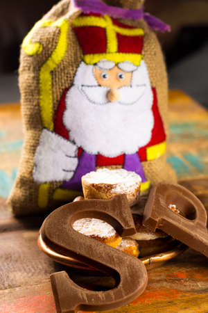Traditional Dutch Saint Nicolas celebration with presents for children in December, Saint Nicolas  gift bag and chocolate letters close upの写真素材