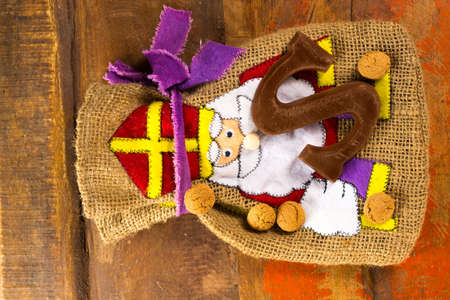 Traditional Dutch Saint Nicolas celebration with presents for children in December, Saint Nicolas  gift bag and chocolate letters close upの写真素材