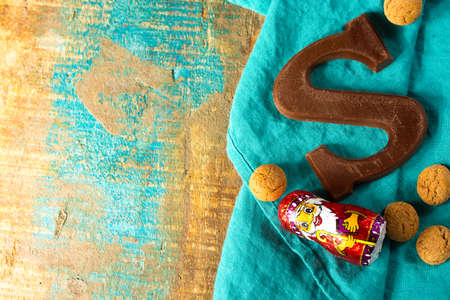 Traditional Dutch Saint Nicolas celebration with presents for children in December, Saint Nicolas chocolate letters and spicy cookies close upの写真素材