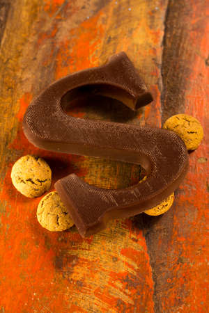 Traditional Dutch Saint Nicolas celebration with presents for children in December, Saint Nicolas chocolate letters and spicy cookies close upの写真素材