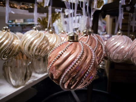 Vintage handmade Christmas tree decoration, light pink balls from heavy glass with ornament, close upの写真素材