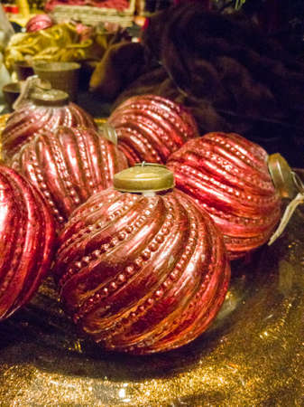 Vintage handmade Christmas tree decoration, red balls from heavy glass with ornament, close upの写真素材