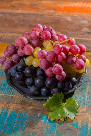 Large organic table grape Globe in assortment served on the tin plate close up
