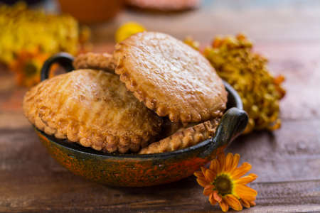 Autumn dessert, stuffed cookies on the wooden table with autums colors decoration,  Thanksgiving food conceptの写真素材