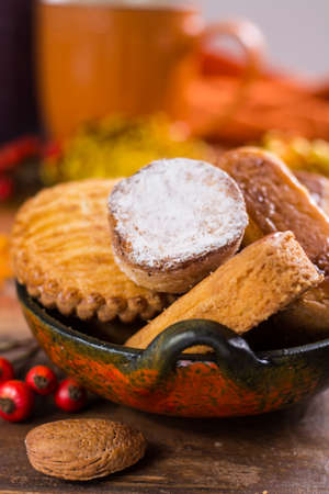 Autumn dessert, stuffed cookies on the wooden table with autums colors decoration,  Thanksgiving...