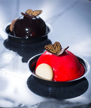 Gourmet french pastry small ball cakes made with fresh strauberry and truffel creme.の写真素材