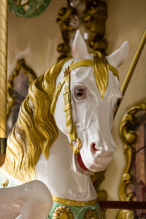 City colorful traditional french carousel for children, vintage horse toy for ridingの写真素材