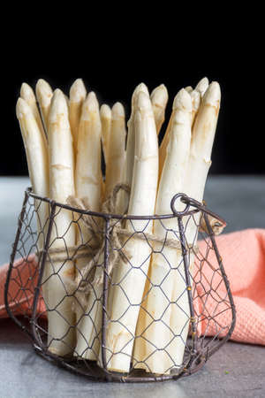 Spring season, new harvest of Dutch, German white asparagus, bunch of raw white asparagusの写真素材