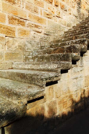 Old stone fortress wall with stone stairの写真素材