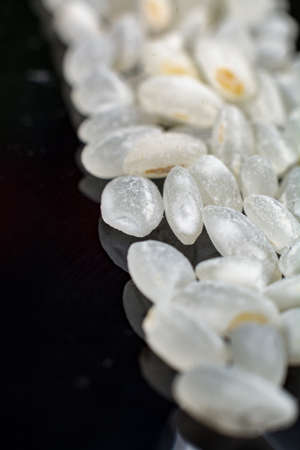 Macro collection, white asian sushi rice close up on black backgroundの写真素材