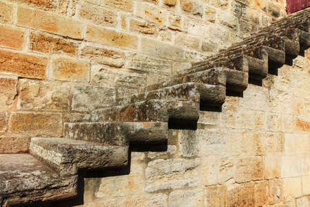 Old stone fortress wall with stone stair
