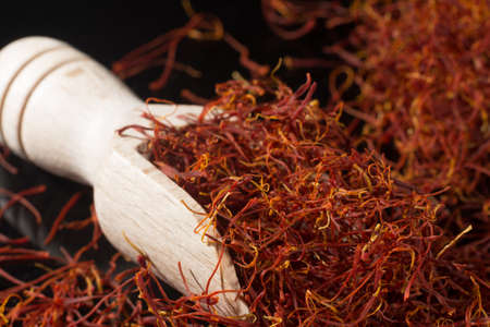 Macro collection, expensive real dried saffron spice close up on black backgroundの写真素材