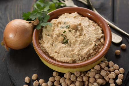 Hummus, dip of spread, everyday meals in Israel made from chickpeas and ingredients that, following Jewish dietary laws Kashrut, can be combined with meat and dairy mealsの写真素材