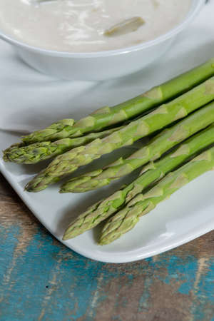 Green asparagus and seasonal fresh homemade asparagus soup made from white and green asparagus, healthy  vegetablesの写真素材