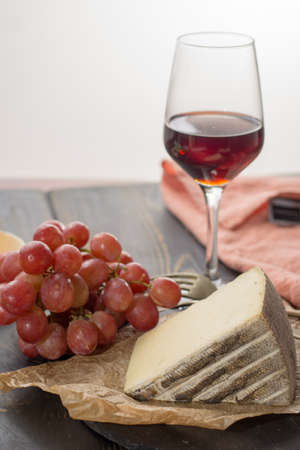 Tasting of ancient french demi soft cheese Tomme from French Alps, made from cow, goat or sheep skim...
