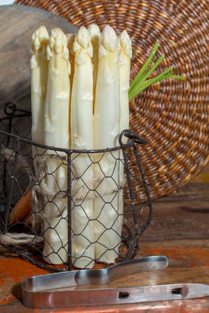 Raw uncooked high quality white asparagus, ready to cook for dinner, seasonal dishの写真素材