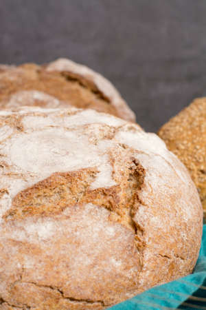 Farmers homemade organic wheat, barley and rye bread in assortment on table