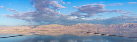 Lowest salty lake in world below sea level Dead sea, full of minerals near luxury vacation resort Ein Bokek, perfect place for medical treatments, climatotherapy, thalassotherapy and heliotherapy.の写真素材