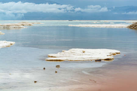 Lowest salty lake in world below sea level Dead sea, full of minerals near luxury vacation resort Ein Bokek, perfect place for medical treatments, climatotherapy, thalassotherapy and heliotherapy.の写真素材