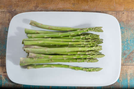 Fresh raw green asparagus ready to cook close upの写真素材