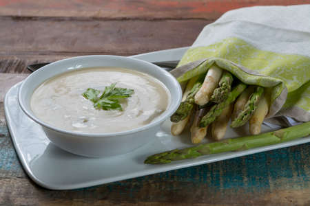 Seasonal fresh homemade asparagus soup made from white and green asparagus, healthy  vegetablesの写真素材