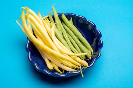 Food concept with fresh legumes, ripe yellow butter beans and green garden beans copy space close up...
