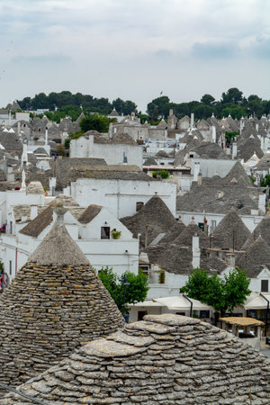Unique small South Italia city Alberobello with antient stones conical houses trullo, tourist destination, Apulia region near Bariのeditorial素材