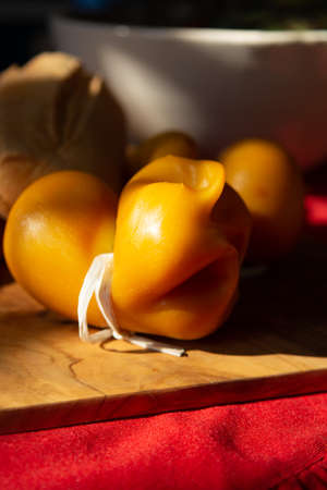 Smoked fresh South Italian traditional cow or cow and sheep semi-soft cheese Scamorza ready to eatの写真素材