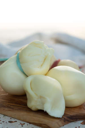 Fresh South Italian traditional cow or cow and sheep semi-soft cheese Scamorza ready to eat