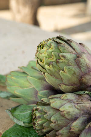 Traditional Italian food, fresh green artichoke vegetables, new harvest, uncookedの写真素材