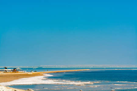 Lowest salty lake in world below sea level Dead sea, full of minerals near luxury vacation resort Ein Bokek, perfect place for medical treatments, climatotherapy, thalassotherapy and heliotherapy.の写真素材