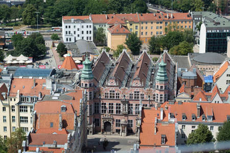 Townscape  with red roofs in old city Gdansk made from top, aerial landscape with tilt-shift effect...