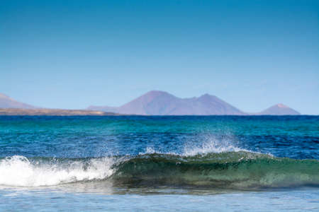 Natural yellow sandy beach in village Orzola, north of Lanzarote, Canary islands, Spain in winter