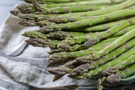 Fresh green uncooked asparagus, healtry vegetables, close upの写真素材