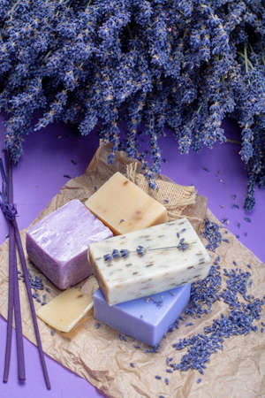 Natural healthy aromatherapy and skin treatment with organic French lavender, lavender soap on purple background with dried lavender flowers close upの写真素材
