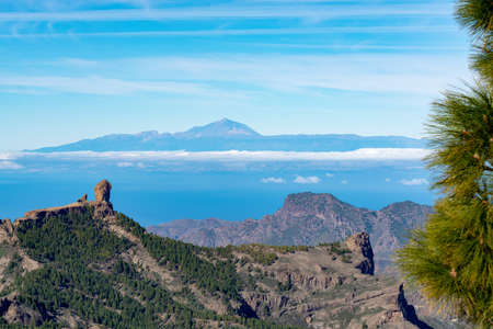 Gran Canaria island mountains and valleys landscape, view from highest peak Pico de las Nieves to Roque Nublo and Mount Teide on Tenerifeの写真素材