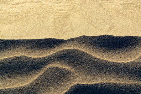 Background with sandy dune waves texture, close up, copy space