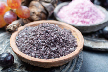 Spa treatment and skin care with Malvasia vulcanic grape aromatic sea salt, close upの写真素材